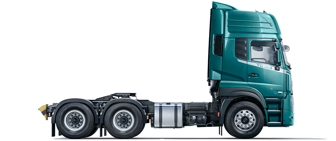 Green semi-truck cab without a trailer, side view on white background.