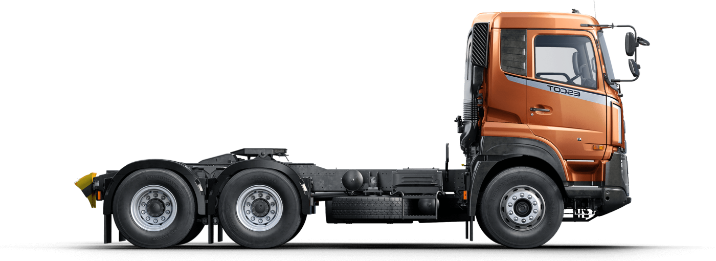 Truk kepala kuning-oranye tanpa bak, tampak samping.