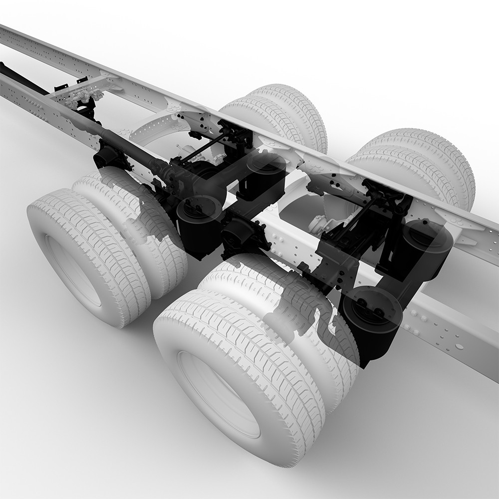 Truck chassis with dual rear axles and suspension system, white background.