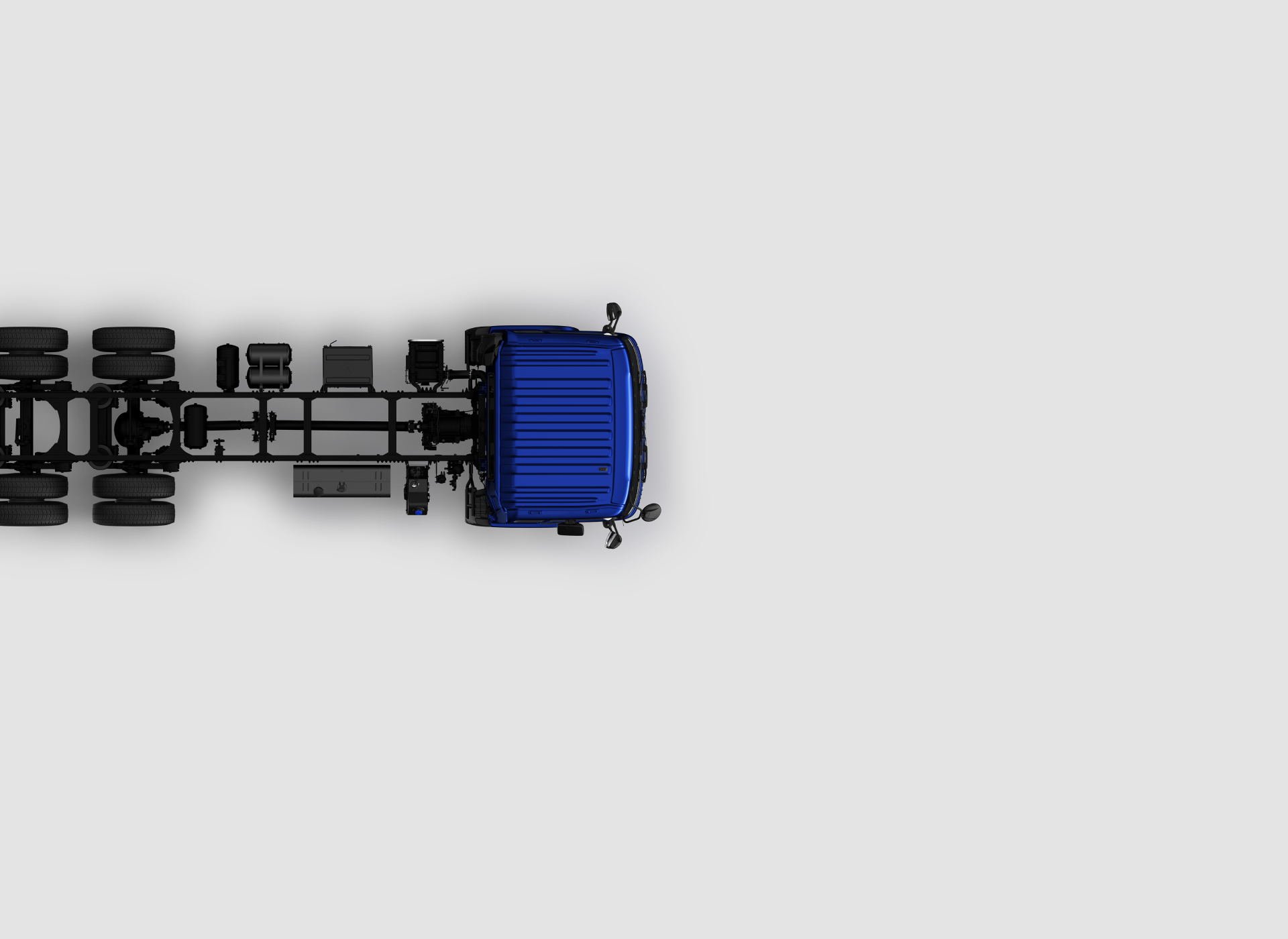 Blou vragmotor gesien van bo teen 'n grys agtergrond